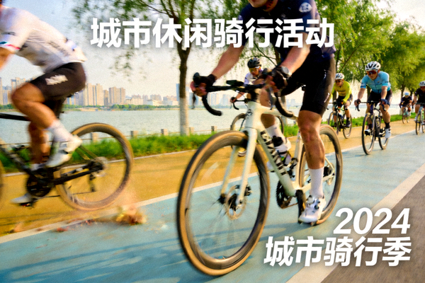 骑行爱好者沿江边绿道骑行 - 城市休闲骑行活动